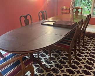 This Dining table has three leaves.  It can easily hold 10 chairs.  It is a solid piece of furniture.  Remove the leaves when you have an intimate party, and add all of them when the entire family visits!  