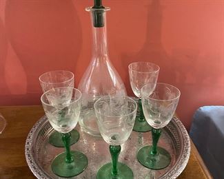 Vintage decanter with five glasses.  Beautiful emerald green stems.