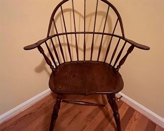 Windsor-style chair.  Cross bar underneath is broken, but could be fixed with a little effort and some glue and a dowel.  Beautiful lines.