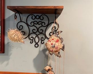 Fish garland and matching shelving complete the perfect coastal cottage.  