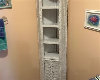 White wicker corner curio cabinet with shelves. 