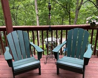 Matching forest green Adirondack chairs. 
