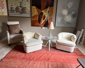 Left is white leather reclining chair 