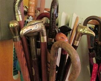 Many collectible canes & umbrellas