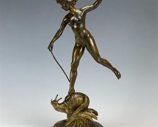 Bronze nude riding a snail signed Suan