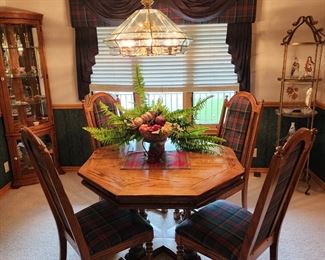 Dining room table 2 leaves and 4 wooden and plaid chairs