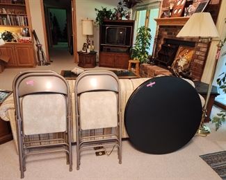 Samsonite folding chairs and a round folding table