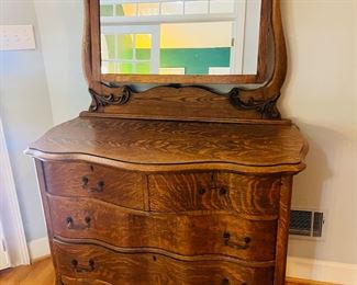 Antique tiger oak dresser with serpentine mirror