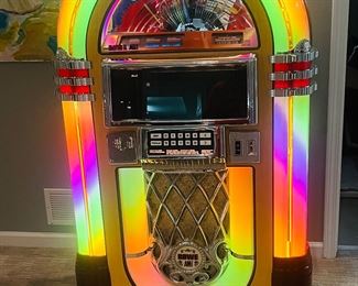 90s Rowe-AMI CD Jukebox, awesome looks and sounds great. 250 watt amp, holds 100 CDs, even has bubbling tubes. Super cool and great quality