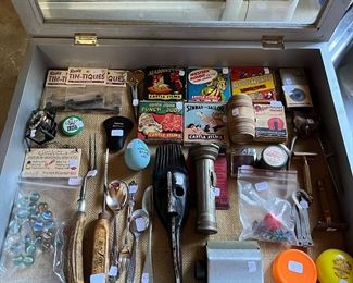 Vintage marbles, bone handled roast fork, vintage flashlight, silver plate spoons and forks, vintage ice pick, vintage cigarette rolling machine, Vintage castle films in original boxes and much more!
