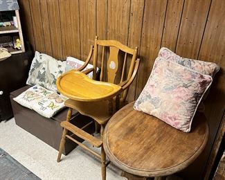 Wooden high chair, oval top table, wood toy chest and sets of pillows