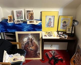 Artwork, hand vac, children’s desk with lamp, and large variety of vintage posters.