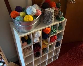 Large variety of yarn and wooden shoe shelf