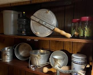 Vintage popcorn maker, meat grinder, canister set and pans