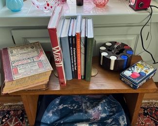 Poker chips and playing cards, flag of earth from space, Small bench and war books