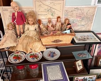 Antique dolls and doll parts, topographic maps of Gates, Ogden and Brighton, vintage jars w/ tops and decorative plates,.