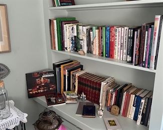 Books and base of antique oil lamp 