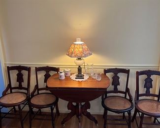 Eastlake dropleaf table and four matching chairs