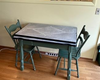 Enamel top table with leaves and matching chairs