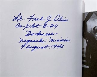 It is also signed by Lieutenant Frederick "Fred" J. Olivi, co-pilot, of the B-29 'Bockscar'