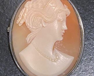 Vintage cameo brooch and pendant with Sterling 925 setting......To register in order to place bids go to www.capitolsalesservices.hibid.com