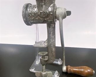 Antique meat grinder......To register in order to place bids go to www.capitolsalesservices.hibid.com