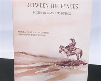 Book, 'Between The Fences, Poetry by Danny W. Dution'......To register in order to place bids go to www.capitolsalesservices.hibid.com