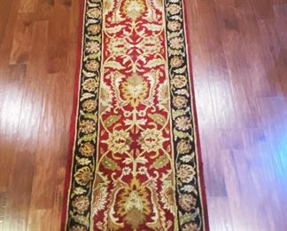 A wool runner......To register in order to place bids go to www.capitolsalesservices.hibid.com rug made in India..