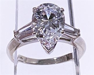 14k white gold ring with pear cut stone. Not a Diamond but more like Swarovski crystal