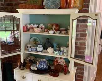 lots of smalls, white wood cabinet