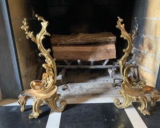 Ornate brass andirons