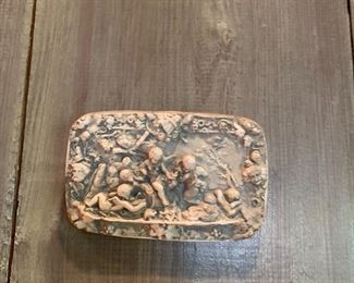 small plaque with cherubs