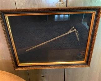 brass child sized bronchoscope framed