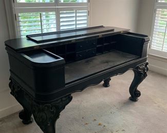 Massive square grand piano converted into a desk