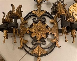 pair of iron and brass sconces