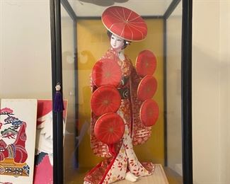 Japanese Geisha porcelain doll in case.  There are several other beautiful geisha girls along with a variety of other oriental treasures throughout the house.  And of course we are loaded with households, furniture, appliances and lots of other great stuff. 