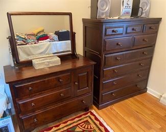 Dark wood dresser with mirror and matching chest of drawers