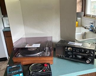 Vintage electronics and toys including  United Audio dual direct drive turntable (German), Sony electronics, Sansui speakers and receiver and POSSIBLY a TEAC reel to reel tape player with several tapes.  Tomytronic TRON video game, Hit and Missile Video game