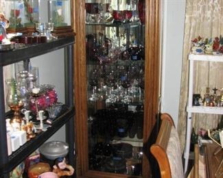 1 of 2 curio cabinets with red glass