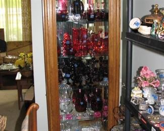 2 of 2 curio cabinets with red glass