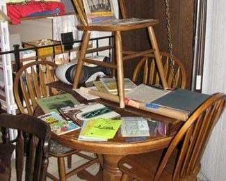 Round table with 4 chairs, local memorabilia and girl scout items