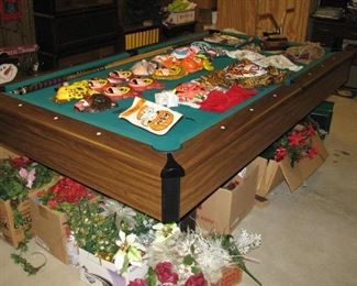 Pool Table covered in vintage Halloween Masks