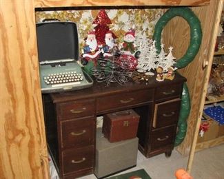 small desk with vintage typewriter, christmas items and 2 projectors under the desk