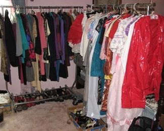 Racks full of vintage and modern clothing, dozens of pairs of shoes