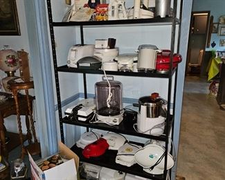 Lots of small appliances! toaster oven, toaster, juicers, presses, baking machines, 