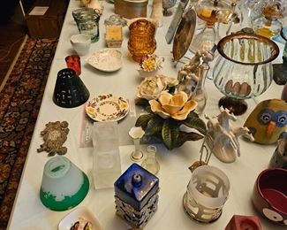 various statues and trinket dishes, candle holders, oil lamps