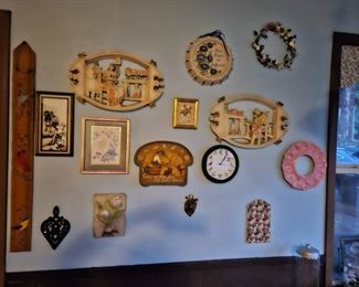 lots of wall art, picture frames, wall sculptures, folk art