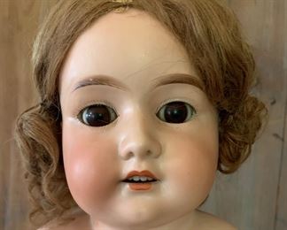 Antique Armand Marseille doll with stuffed Excelsior cloth body, replaced clothing - 1981 Receipt from Doll repair shop: combed hair, lace added to dress, sewed head onto body, evened legs $20. 