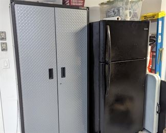 Metal storage cabinet, black Frigidaire fridge