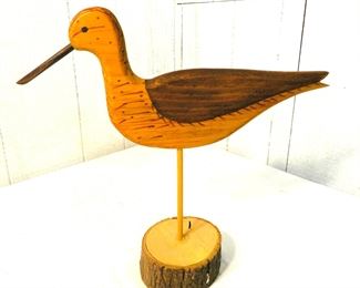 wood decoy on stand